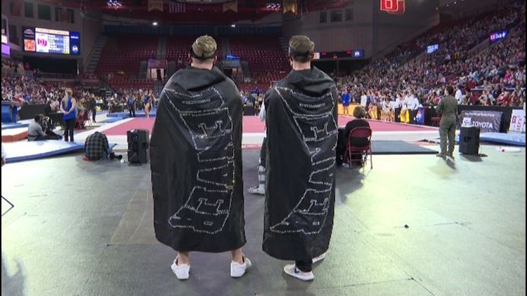 The men beneath the capes at DU gymnastics meets