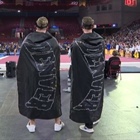 The men beneath the capes at DU gymnastics meets