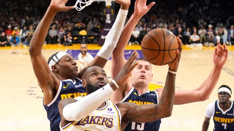 LeBron scores 30, Lakers avoid 1st-round elimination with a 119-108 win over Denver