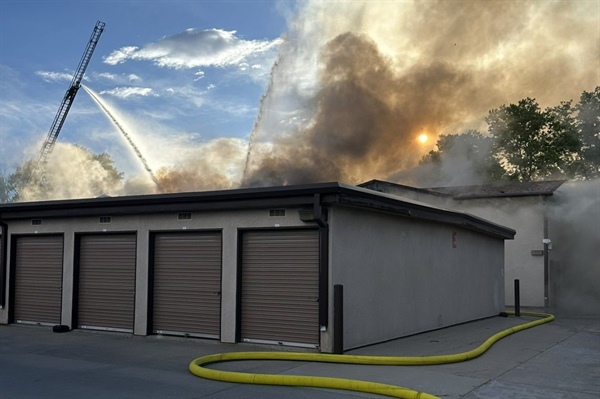 Arvada crews battle storage unit fire burning along I-70, smoke blinds morning commuters