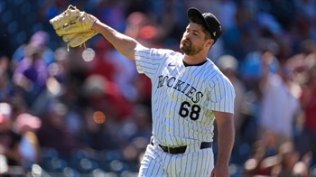 Reds rally late in 9th to sweep Rockies at Coors Field