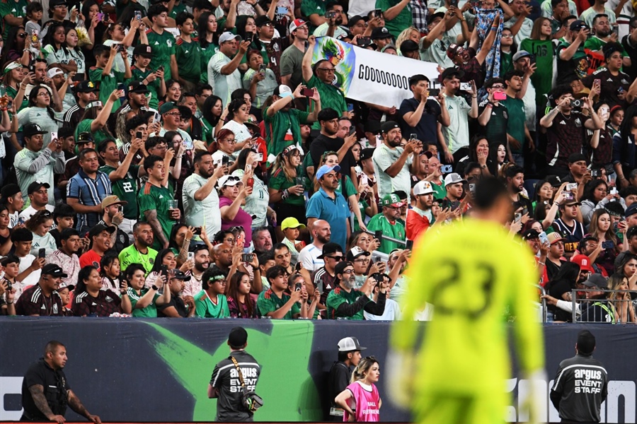 Fans rush Empower Field during Mexico-Uruguay soccer match, 6 arrested for...