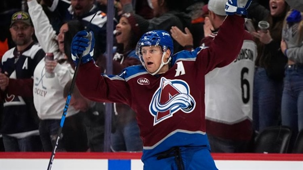 MacKinnon scores in OT to lift Avalanche past Ducks 4-3 for 1st win