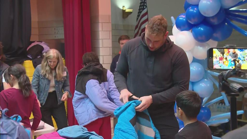 Denver Broncos Zach Allen handed out coats to students at Ellis Elementary School