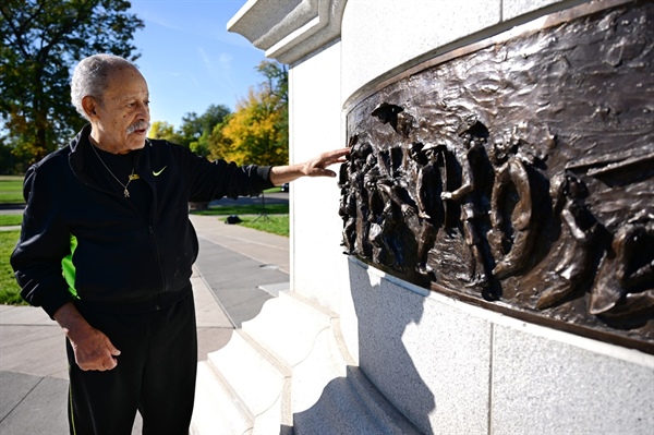 Artist Ed Dwight repairs vandalized MLK Jr. memorial in service to “all of Denver”