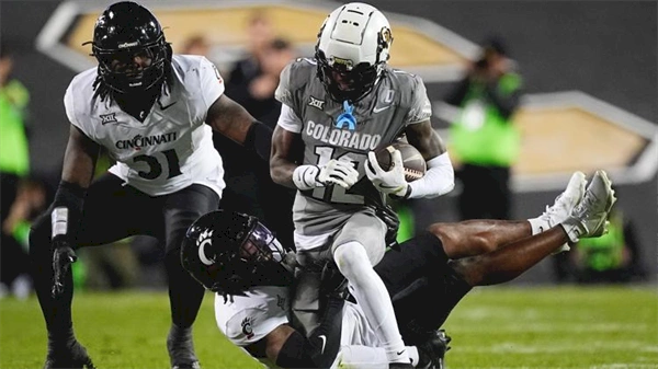 Shedeur Sanders, Travis Hunter help CU beat Cincinnati 34-23 to become bowl eligible