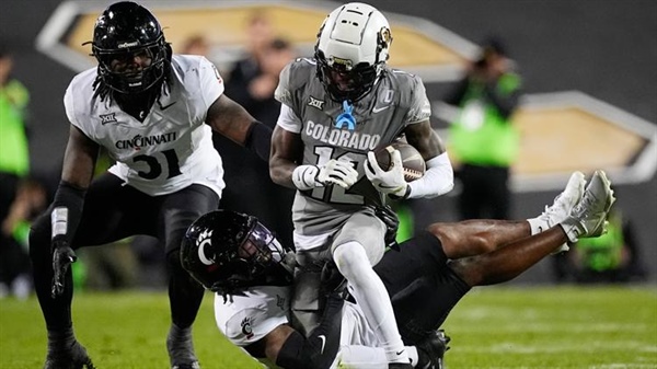 Shedeur Sanders, Travis Hunter help CU beat Cincinnati 34-23 to become bowl...