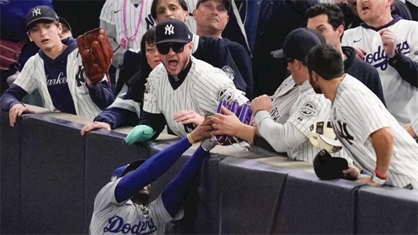 Yankee Stadium fans ejected after one pries ball out of Mookie Betts' glove at World Series