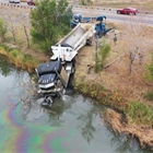 Semi-truck crashes into pond in Brighton, no injuries reported