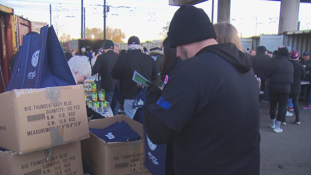 Staff from Nuggets and Ibotta help pack meals for Denver Public Schools students