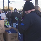 Staff from Nuggets and Ibotta help pack meals for Denver Public Schools students