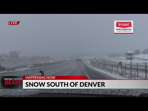 Snow falls on roads south of Denver