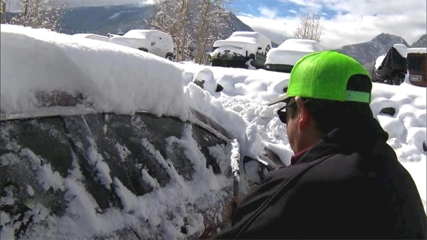 Drivers make unplanned stops at hotels in Colorado's mountains due to troubles on Interstate 70 during snowstorm