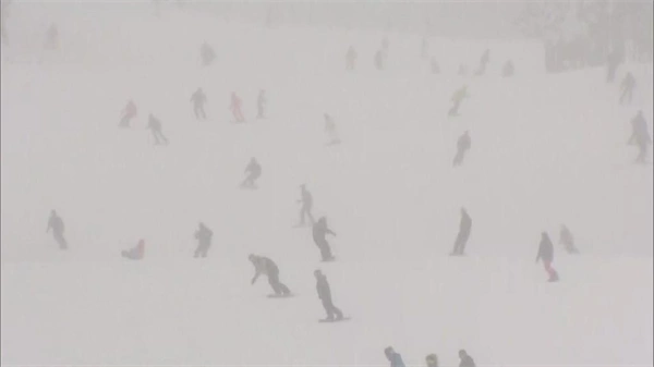 Joyful skiers enjoy opening day at Breckenridge during Colorado snowstorm