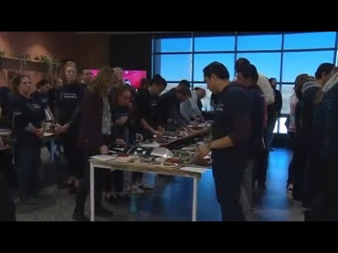 Volunteers build skateboards that will be given to Colorado students