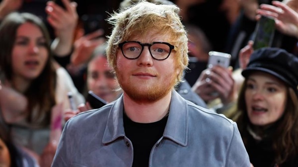 Pop star Ed Sheeran helps favorite soccer team sign player before getting on stage with Taylor Swift