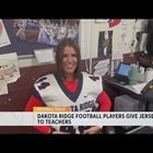 Football Friday: Dakota Ridge football players give jerseys to teachers