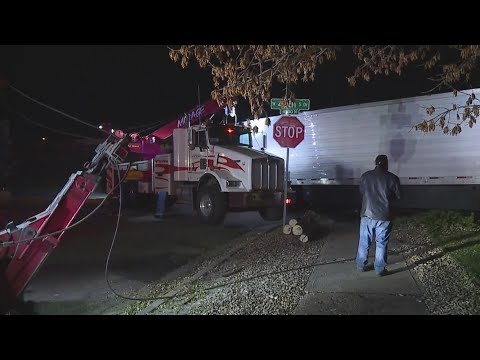 3 in hospital after a semi rolled over into neighborhood